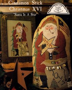 an old fashioned christmas sack with santa claus and other decorations on it, next to a star