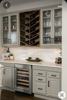 a wine rack in the middle of a kitchen