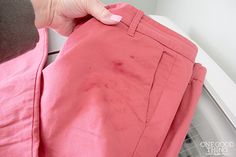 the person is trying to sew something out of their pink pant leggings