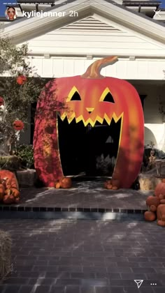 an outdoor halloween decoration with pumpkins and jack - o'- lanterns