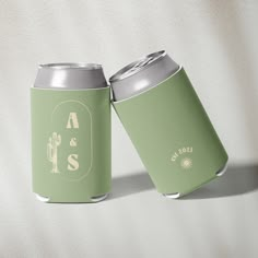 two green can coolers sitting next to each other