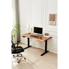 an office desk with a computer on it and a chair in front of the desk