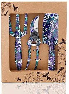 an open box with four pieces of knife and fork set in floral print design on it