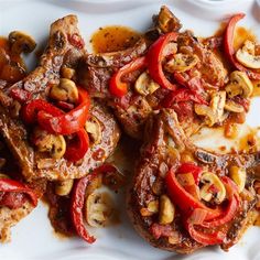 some meat and vegetables on a white plate