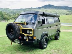 an off road vehicle parked in the grass