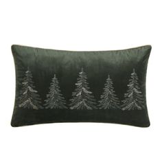 a green velvet pillow with silver pine trees on the front and back, in grey