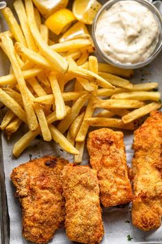 air fryer fish and chips with ketchup on the side in a tray