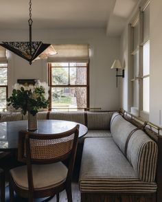 a living room filled with furniture and windows