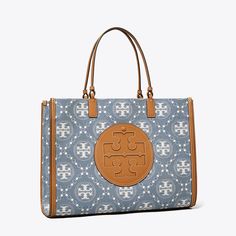 Our iconic tote and signature T Monogram combine in washed denim jacquard. Instantly recognizable, our Ella Tote is a versatile essential — sturdy and light, spacious and streamlined, with an oversized logo. Tory Burch Ella Tote, T Monogram, Ella Tote, Tory Burch Ella, Tory Burch Tote, Monogram Tote Bags, Designer Tote Bags, Womens Designer Handbags, Oversized Bag