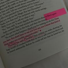 an open book with writing on it and pink highlights in the pages, which appear to have been altered