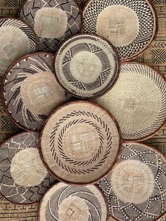 several woven baskets sitting on top of each other