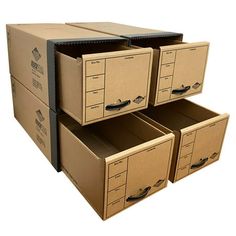 four boxes stacked on top of each other with one open drawer next to the bottom