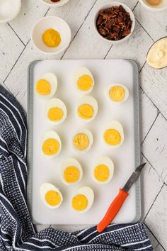 hard boiled eggs on a baking sheet with other ingredients