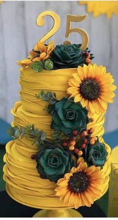 a yellow cake with sunflowers and greenery on top is the number twenty five