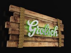 a wooden sign that says grolsch on it