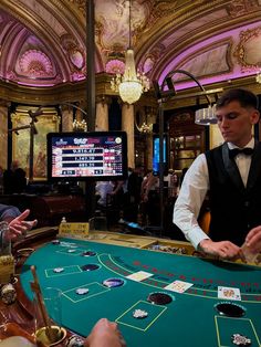 two men are playing roulejack in a casino