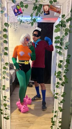 the man and woman are dressed up as characters from cartoons, including an animated character