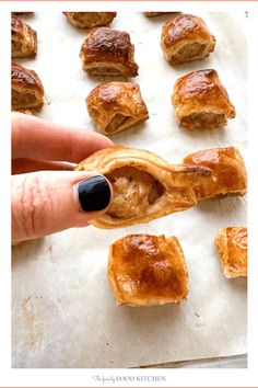 a person is holding onto some food on a baking sheet