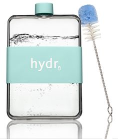 a blue toothbrush sitting next to a water bottle with hydro written on the side