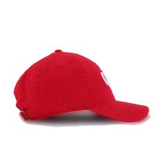 a red baseball cap with the word's on it, sitting against a white background