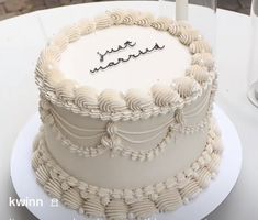 a white cake sitting on top of a table