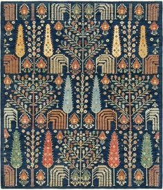 an intricately designed rug with blue and orange colors