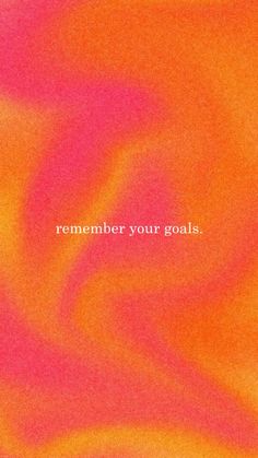 an orange and pink blurry background with the words,'remember your goals '