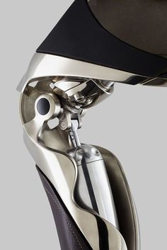 the top part of a silver and black motorcycle