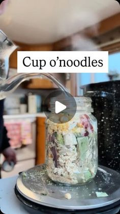 a person pouring something into a glass jar on top of a plate with the words cup o'noodles