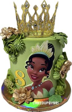 a princess and the frog birthday cake with a tiara on it's head