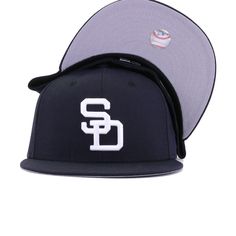 New Era Cap 59Fifty fitted hat for the San Diego Padres in navy blue colorway. Throwback logo gets the colorway from the 90s and 2000s. The result is a super-clean look that is perfect for everyday wear. With bright Snow White logo popping against the dark backdrop of the Navy wool, this is simplicity at its most perfect form. Hat Material: 100% WoolCrown: NavyVisor: NavyButton: NavyUndervisor: GreyFront Logo: Snow WhiteNew Era Flag: Midnight NavyRear Logo: Midnight Navy/Snow White/Light Navy Navy Fitted Hat With Flat Brim For Baseball Season, Navy Flat Brim Fitted Hat For Baseball Season, Navy Fitted Hat For Sports Events, Navy Flat Bill Hat For Sports Events, Navy Fitted Hat With Flat Bill For Sports Events, Navy Flat Bill Fitted Hat For Sports Events, Navy Snapback Fitted Hat For Baseball Season, Navy Fitted Hat For Baseball Season Streetwear, Navy Fitted Hat With Curved Brim For Streetwear