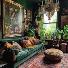 a living room filled with lots of green furniture and paintings on the wall above it