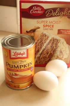 two eggs and a can of cake mix sitting on a counter next to a package of deli lights