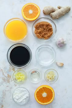 the ingredients for an orange smoothie laid out in bowls