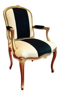 an antique chair with black and white stripes on it's upholstered back