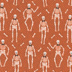 an orange and white skeleton pattern with polka dots