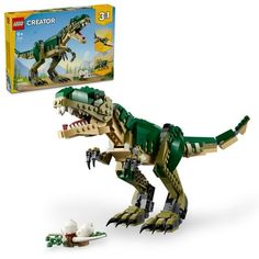 a lego dinosaur is shown in front of the box