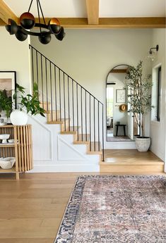 a living room filled with furniture and a large rug