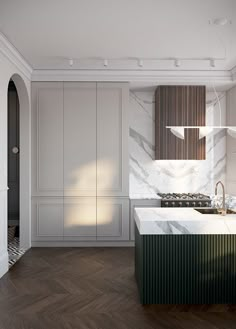 an empty kitchen with marble counter tops and wood flooring