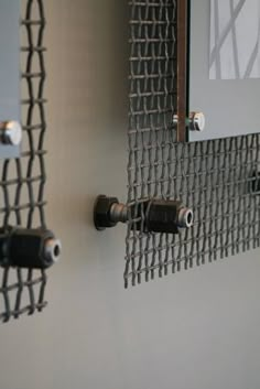 there are two metal objects hanging on the wall