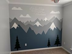 a bedroom with mountains painted on the wall