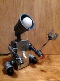 Robot Lamp (with metal flower) Industrial Pipe Lamp, Robot Lamp, Lamp Inspiration, Industrial Robots, Industrial Style Lighting, Steampunk Lamp, Pipe Lamp, Gadgets Technology Awesome, Wall E