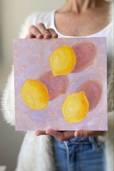 Photo of a person holding an original oil painting of three vibrant yellow lemons on a textured lilac background Prints For Kitchen, Grapefruit Oil Painting, Oil Painting Basics, Oil Painting Gallery, Simple Oil Painting, Oil Painting For Beginners, Drawing Interior