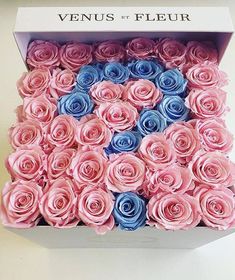 a box filled with pink and blue roses