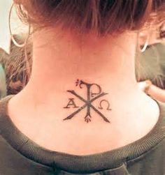 a woman with a tattoo on her neck has the letter k in cursive writing