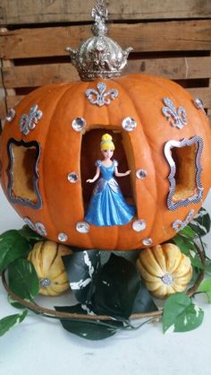 a pumpkin shaped like a princess with a crown on top