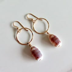 Cowrie Shell Earrings~ Pretty purple and white cowrie shells dangle from  14k gold fill Rings. Dangles from bottom of ear wire approx. 2" SHOP~ https://www.etsy.com/shop/HanaMauiCreations?ref=si_shop Surfer Girl Fashion, Photograph Jewelry, Cowrie Shell Earrings, Earrings Gold Hoops, Coastal Jewelry, Earrings Pretty, Boho Jewels, Surfer Girl Style, Hawaiian Jewelry