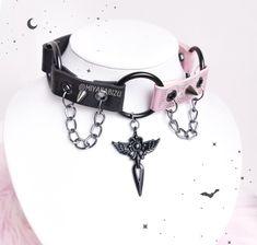 Creepycute choker made from eco strap (width 20mm/ 0.79"). Decorated with black cross charm, 3 o-rings, spikes and aluminium chain.  Available in 2 version:  1. Black 2. Black and Pink The lenght of chokers: 32cm/12,6" + 5cm/1,97" of chain Size of Cross charm: 4,8cm/1.89" ATTENTION! REGISTERED LETTER- estimate shipping time is about 1-2 weeks to European Union and 3-4 weeks to outside the European Union. Tracking number doesn't work outside Poland, but it is proof of posting the package so if yo Harajuku Style Black Jewelry, Adjustable Emo Choker For Cosplay, Pink Punk Halloween Jewelry, Edgy Adjustable Pink Jewelry, Adjustable Edgy Pink Jewelry, Pink Punk Choker As Gift, Pink Punk Choker As A Gift, Punk Style Pink Choker Gift, Pink Punk Choker For Gift