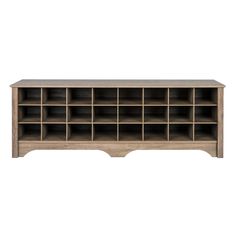 a wooden shelf with many compartments on it