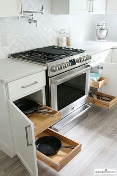 an open drawer in the middle of a kitchen